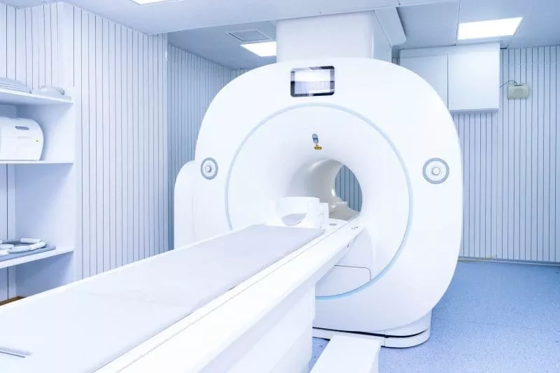Empty MRI scanner in a clean, modern medical imaging room.